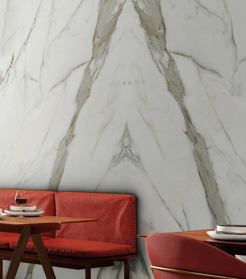 Statuario marble slab showing bold grey veining on white background